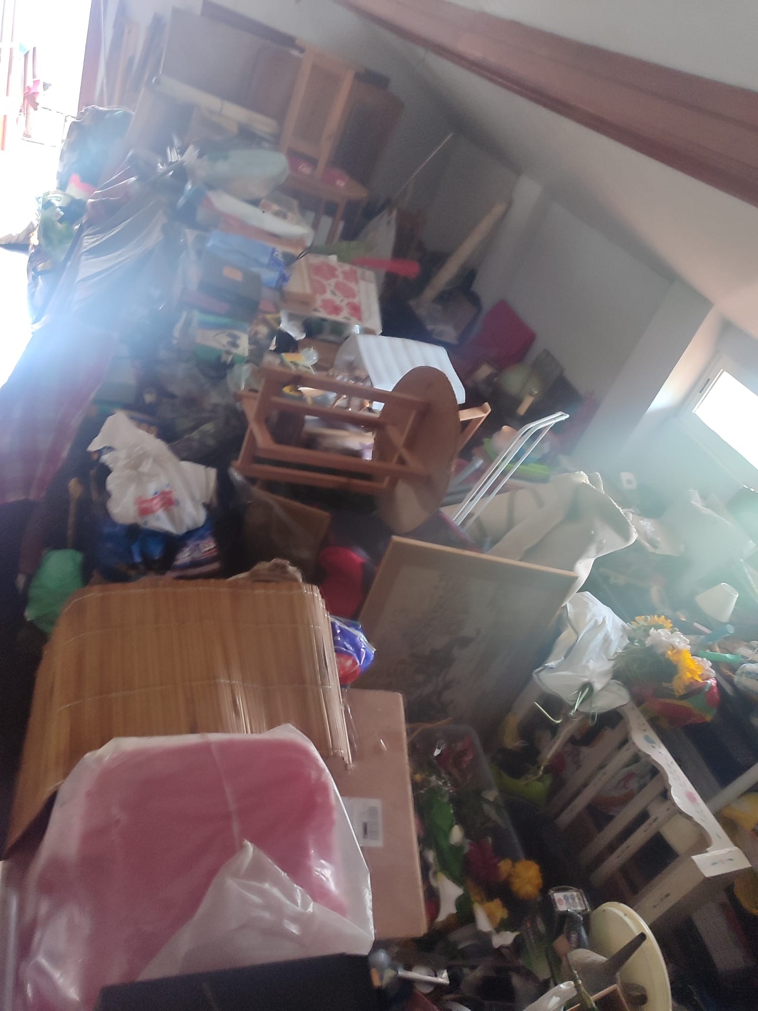 The family's damaged home filled with displaced furniture and belongings