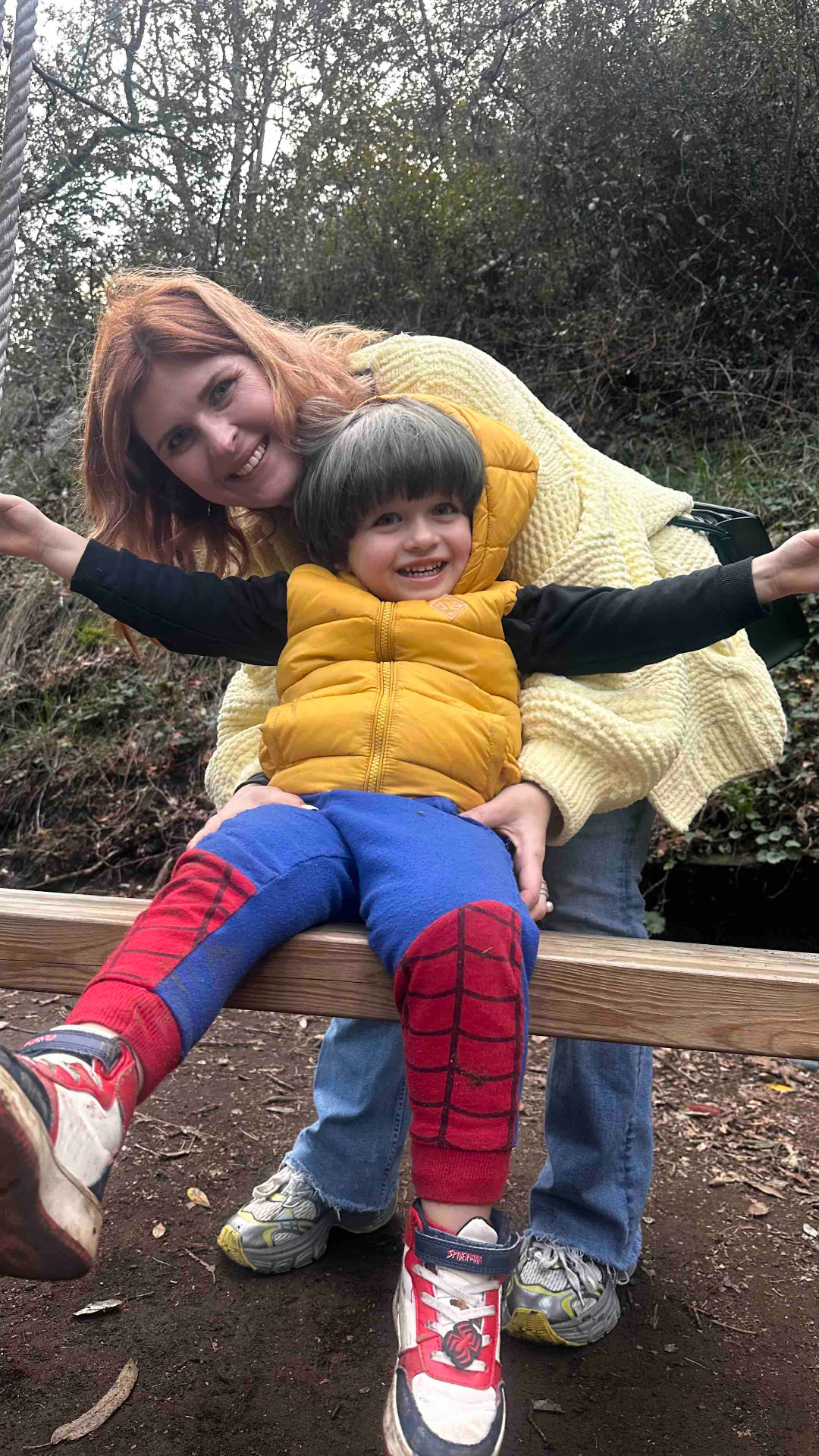 Jenny sharing a joyful outdoor moment with one of her children