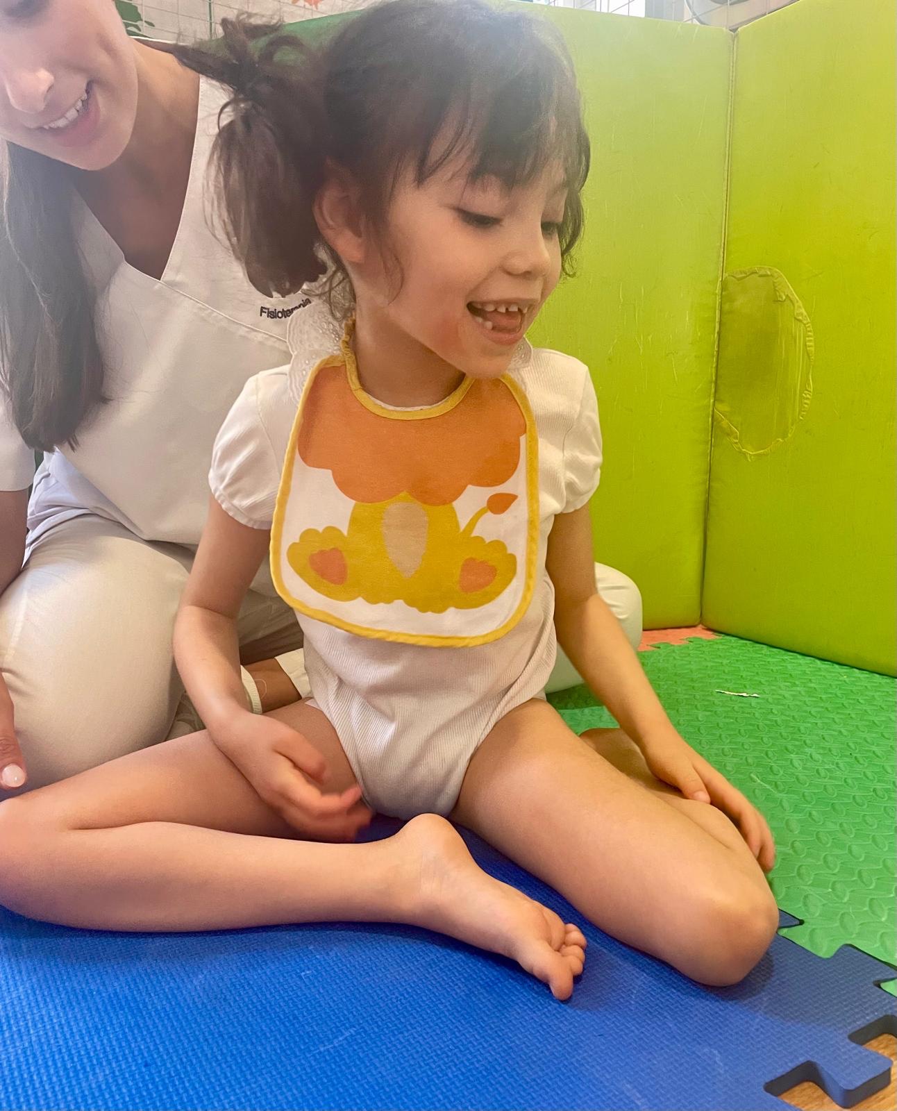 Sarah smiling during a physical therapy session