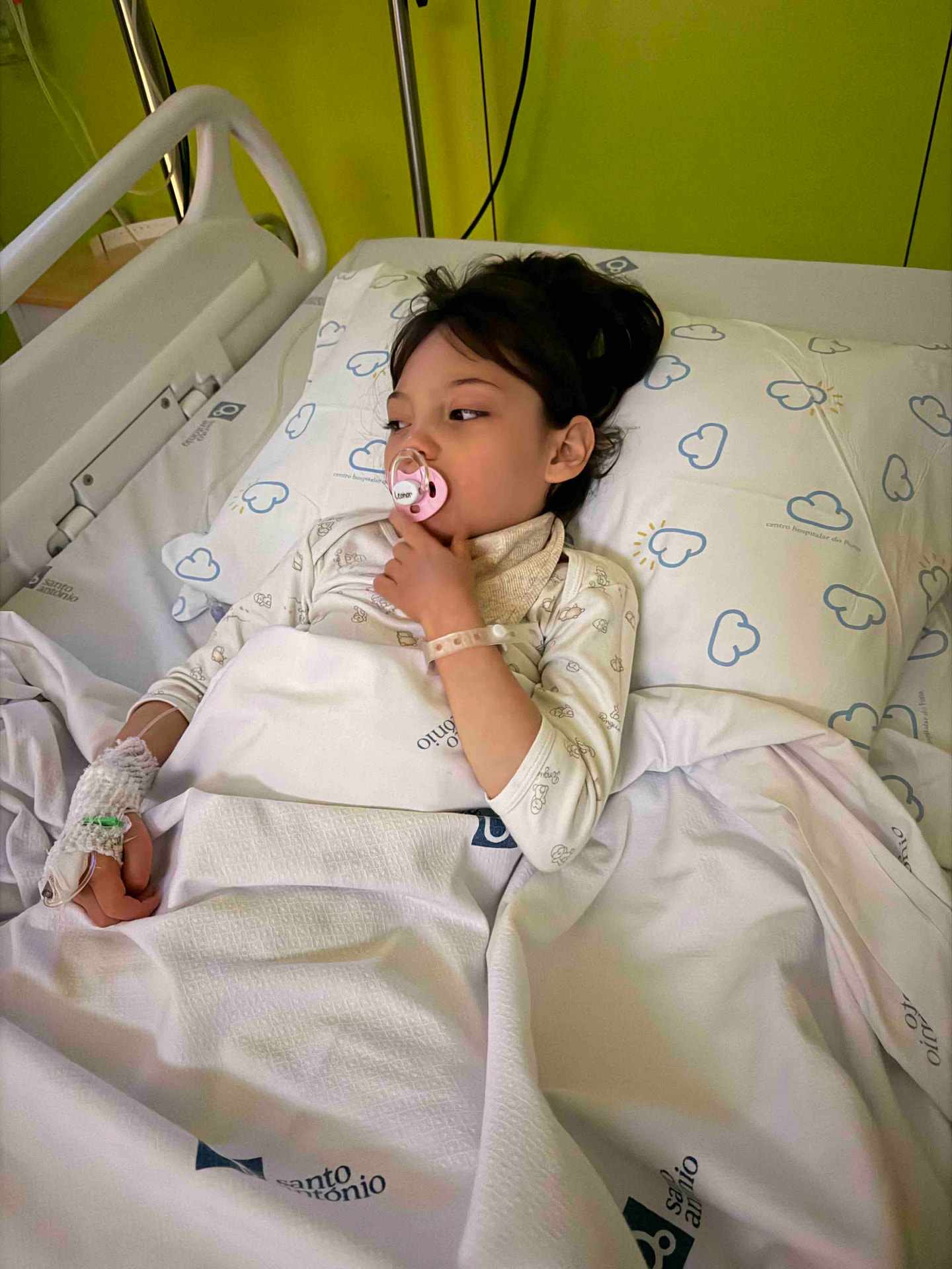 Sarah resting in a hospital bed during treatment
