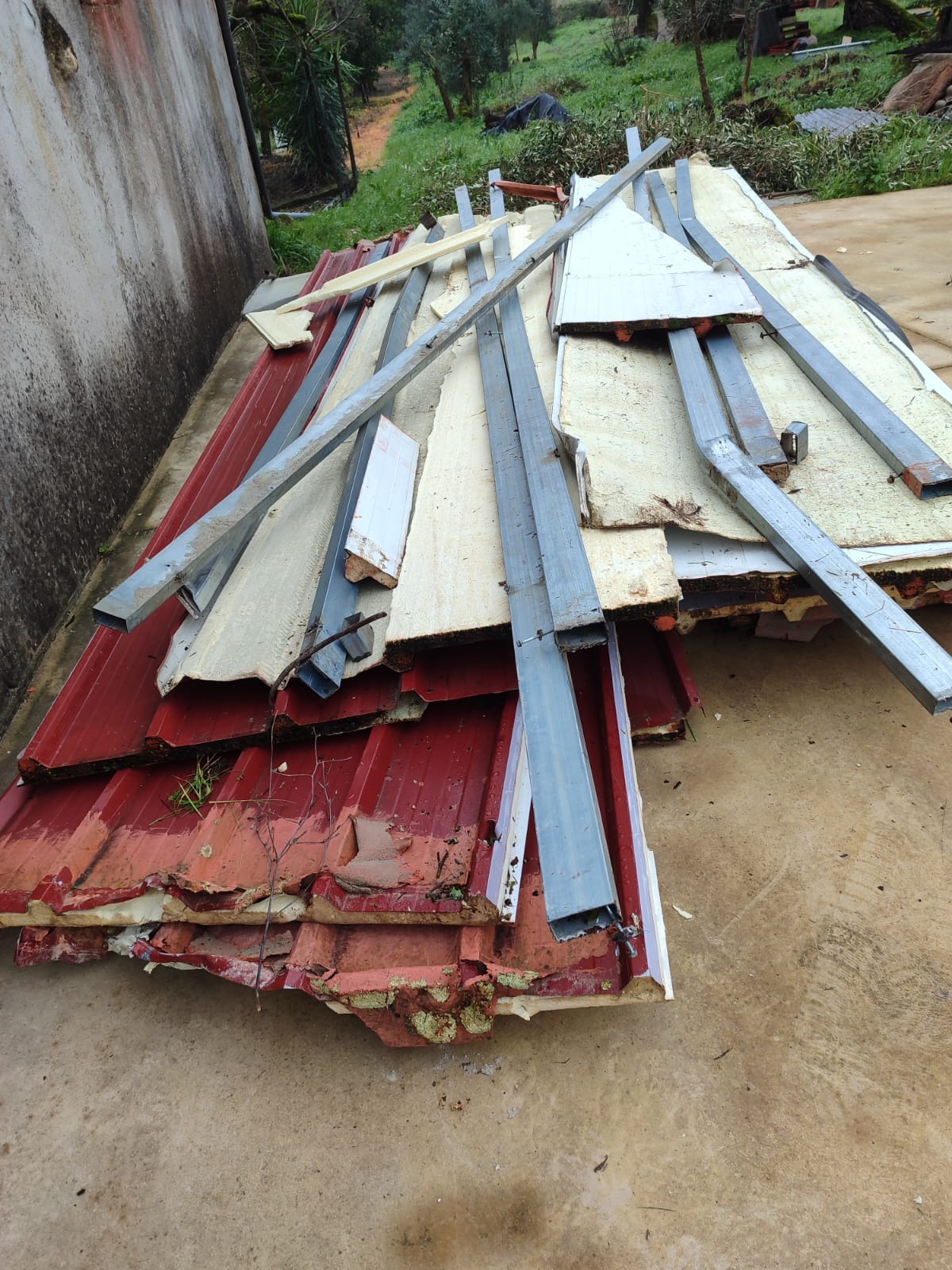 Twisted roofing and building materials left behind by the tornado